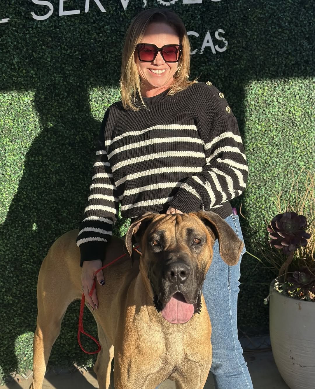 woman with sunglasses and dog